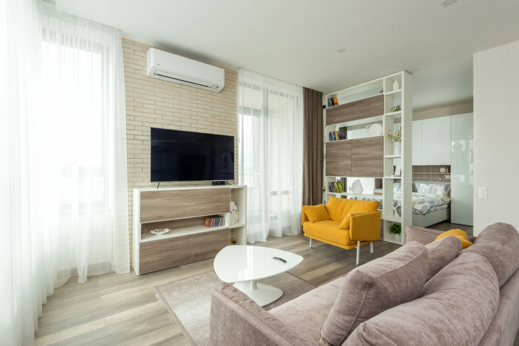 Picture of a living room with an air conditioning unit running but not cooling house