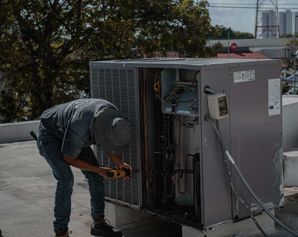 Picture of a technician evaluating refrigerator repair vs replace