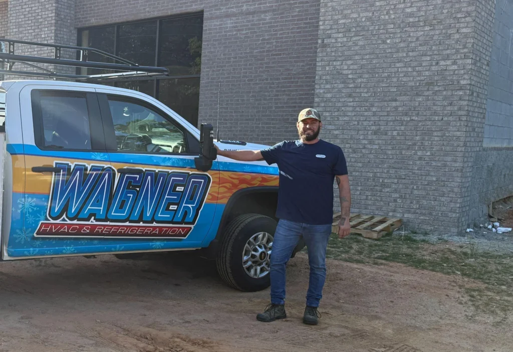 Picture of a Wagner HVAC owner next to his truck