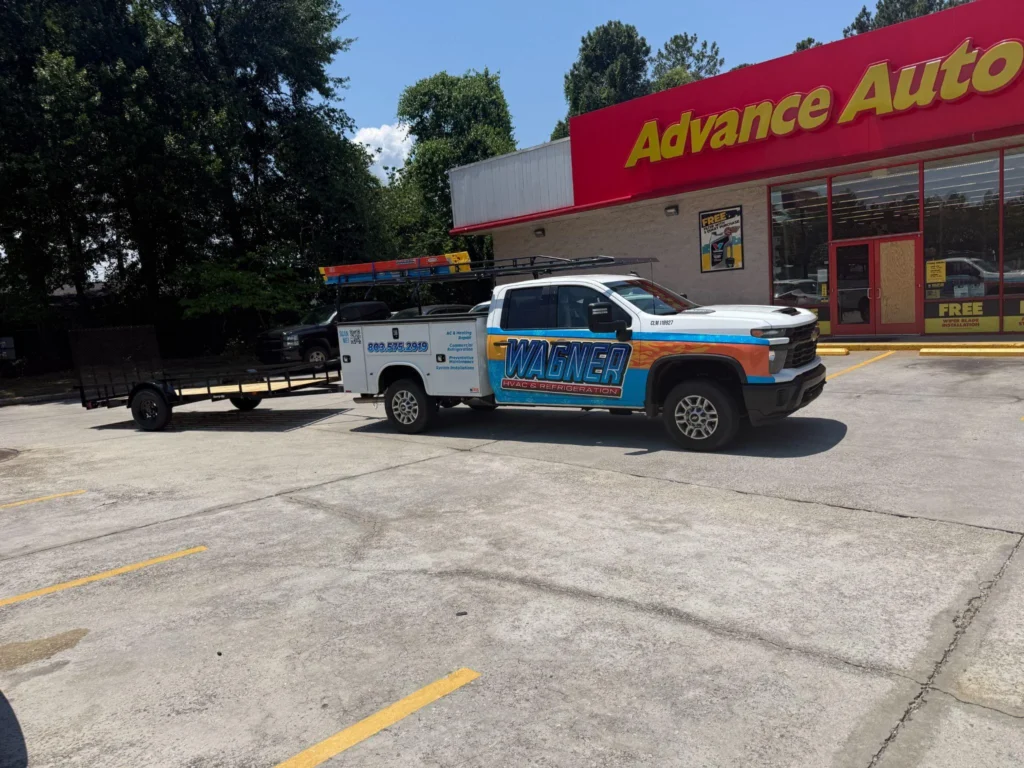 Picture of a Wagner HVAC service truck with a trailer parked outside