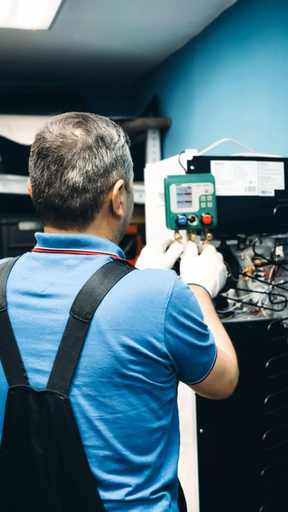 picture of a technician servicing a commercial refrigeration unit