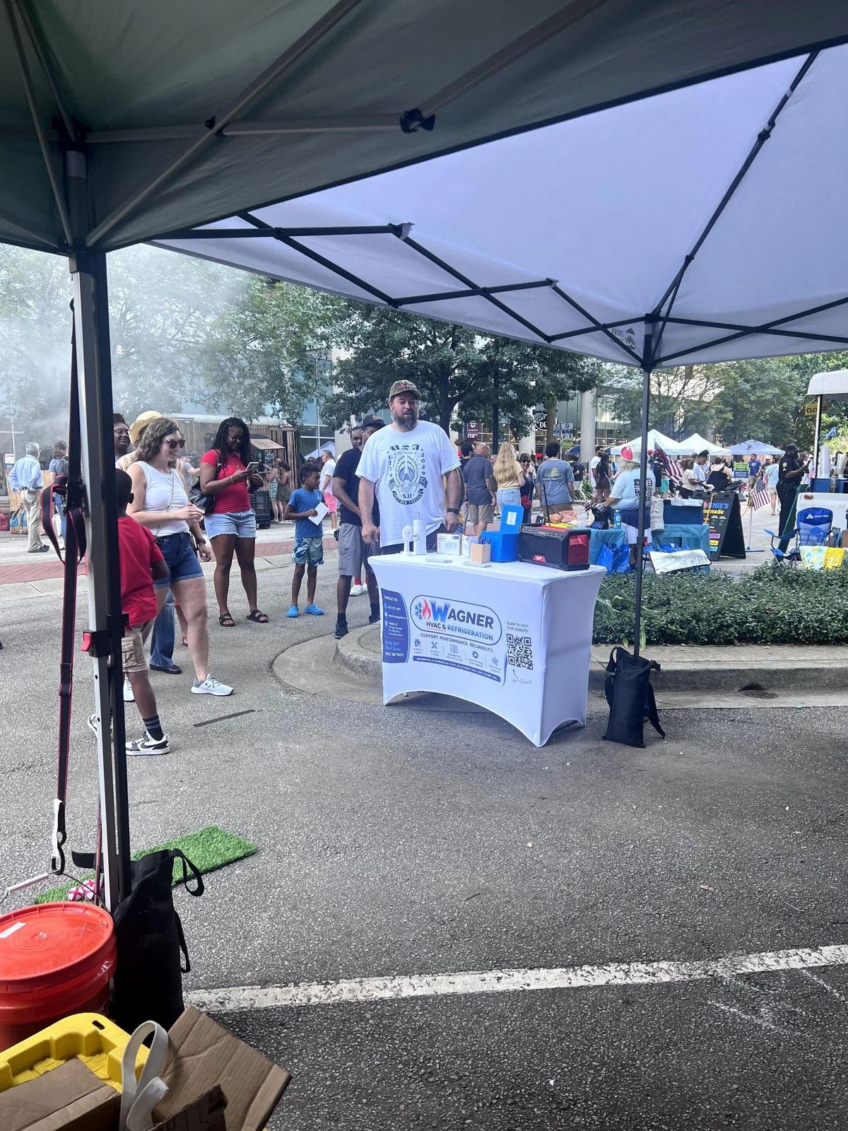 Picture of a Wagner HVAC information booth set up under a white tent